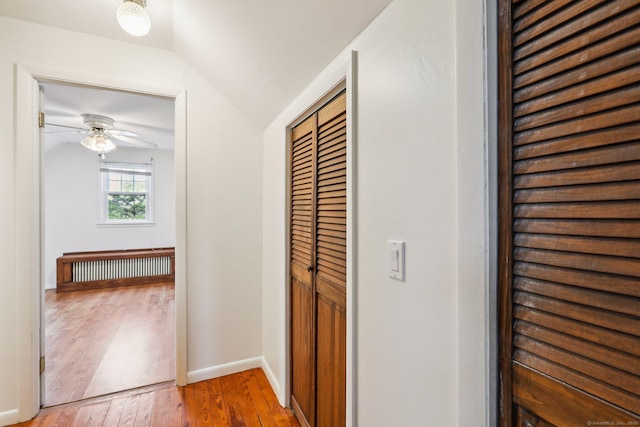 9 Fairfield Ave, Danbury, CT 06810 - hall featuring wood finished floors, radiator heating unit, and lofted ceiling