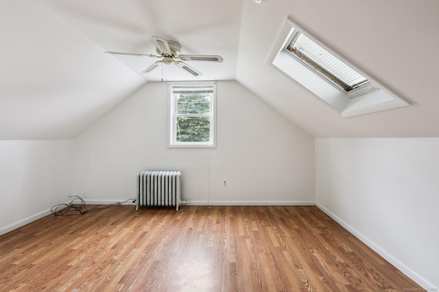 9 Fairfield Ave, Danbury, CT 06810 - bonus room featuring radiator, a skylight, light wood finished floors, a ceiling fan, and lofted ceiling