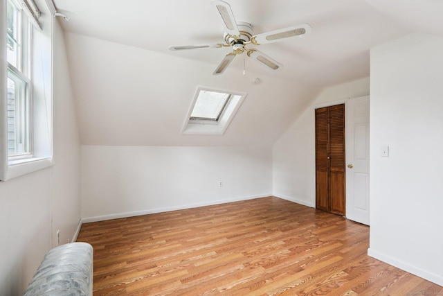 9 Fairfield Ave, Danbury, CT 06810 - bonus room with a skylight, vaulted ceiling, a ceiling fan, and light wood-type flooring