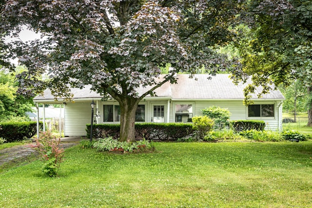 7 Weymouth Dr, Enfield, CT 06082 - back of house with a lawn and an attached carport