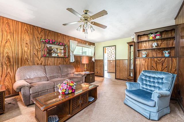 7 Weymouth Dr, Enfield, CT 06082 - living area with wooden walls, a ceiling fan, wainscoting, and carpet