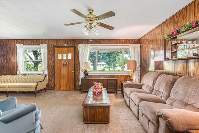 7 Weymouth Dr, Enfield, CT 06082 - living area featuring wood walls, carpet, and a ceiling fan