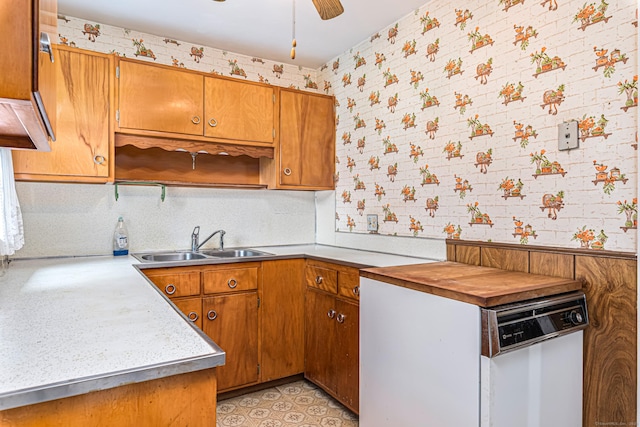 7 Weymouth Dr, Enfield, CT 06082 - kitchen featuring wallpapered walls, light countertops, brown cabinets, white dishwasher, and ceiling fan