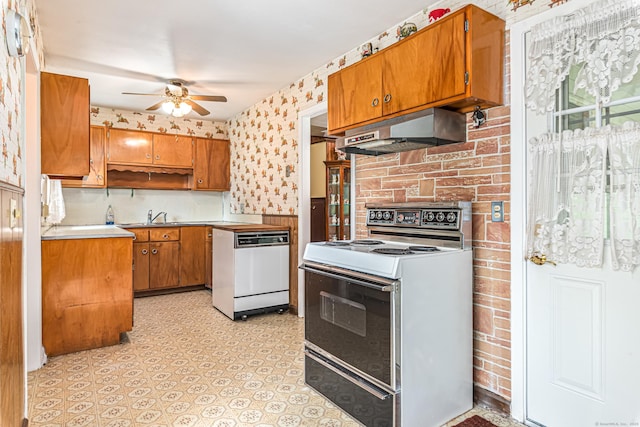 7 Weymouth Dr, Enfield, CT 06082 - kitchen with range with electric stovetop, white dishwasher, under cabinet range hood, ceiling fan, and brown cabinets