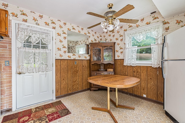 7 Weymouth Dr, Enfield, CT 06082 - dining room with a wainscoted wall, wallpapered walls, ceiling fan, and wood walls
