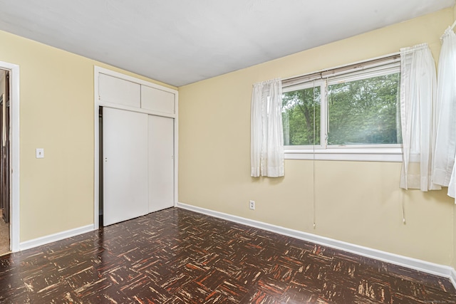 7 Weymouth Dr, Enfield, CT 06082 - unfurnished bedroom with baseboards and a closet