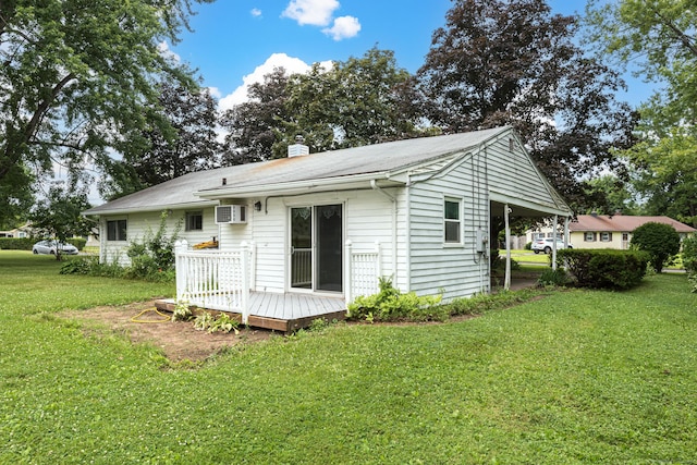 7 Weymouth Dr, Enfield, CT 06082 - back of house with a wooden deck, a wall mounted air conditioner, a yard, and a chimney