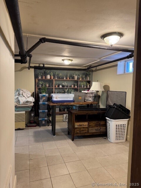240 Walnut St, Windham, CT 06226 - below grade area with tile patterned flooring