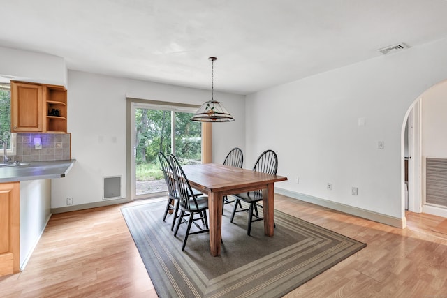 3 Yale Ave, Shelton, CT 06484 - dining space featuring arched walkways and light wood-style floors