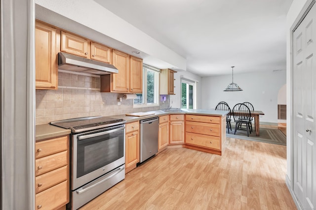 3 Yale Ave, Shelton, CT 06484 - kitchen featuring stainless steel appliances, under cabinet range hood, light brown cabinetry, a peninsula, and light wood-style flooring