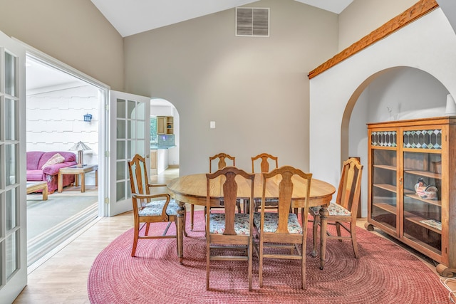 3 Yale Ave, Shelton, CT 06484 - dining area with arched walkways, light wood-type flooring, and high vaulted ceiling