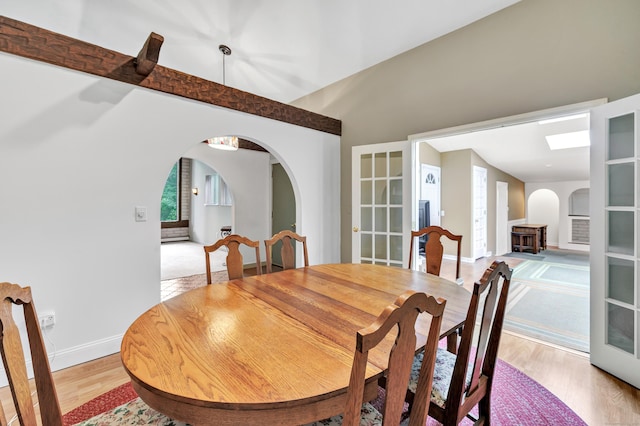 3 Yale Ave, Shelton, CT 06484 - dining area with arched walkways, light wood-style floors, and french doors