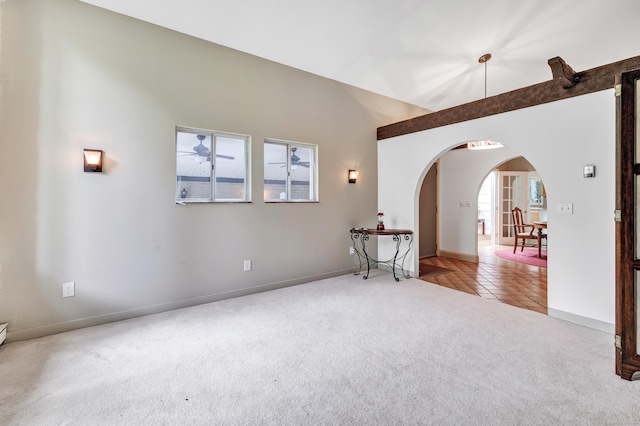 3 Yale Ave, Shelton, CT 06484 - unfurnished room featuring arched walkways, carpet, tile patterned flooring, and ceiling fan