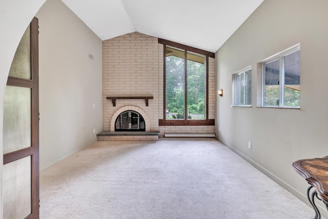 3 Yale Ave, Shelton, CT 06484 - unfurnished living room with carpet flooring, lofted ceiling, a brick fireplace, and baseboard heating