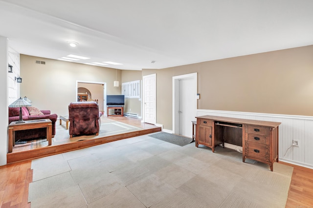 3 Yale Ave, Shelton, CT 06484 - sitting room featuring a baseboard heating unit, a wainscoted wall, and light wood finished floors
