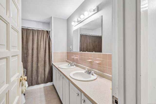 3 Yale Ave, Shelton, CT 06484 - full bath with double vanity, tile patterned floors, and backsplash