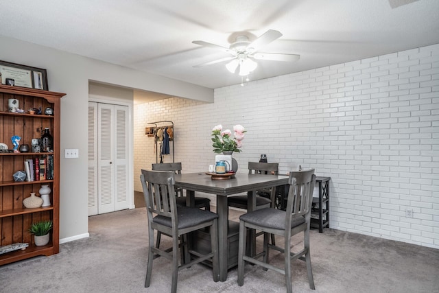 506 Twin Circle Dr Unit 506, South Windsor, CT 06074 - carpeted dining area with brick wall and ceiling fan