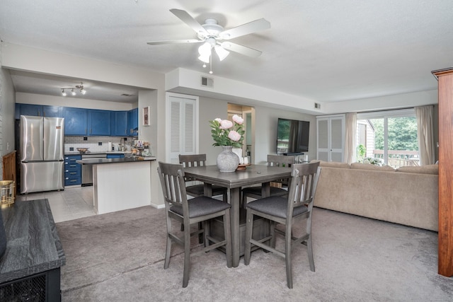506 Twin Circle Dr Unit 506, South Windsor, CT 06074 - dining space with light colored carpet and ceiling fan