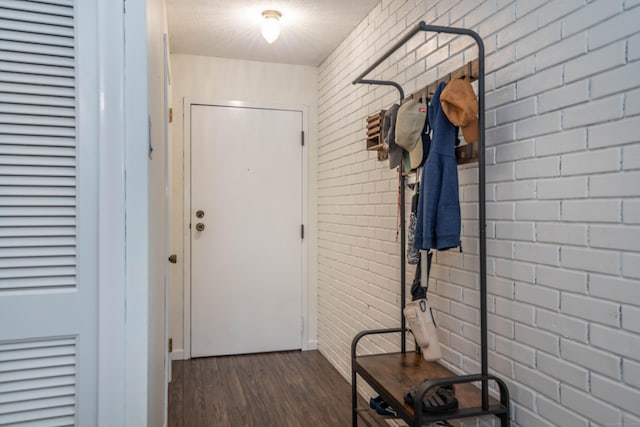 506 Twin Circle Dr Unit 506, South Windsor, CT 06074 - doorway with wood finished floors and brick wall