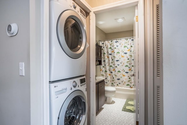 506 Twin Circle Dr Unit 506, South Windsor, CT 06074 - laundry room with estacked washer and dryer and tile patterned floors