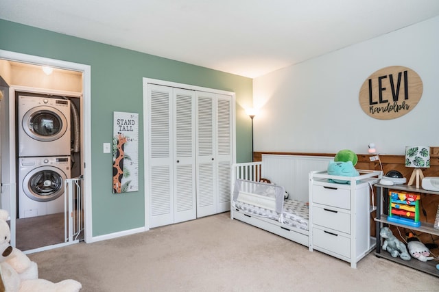 506 Twin Circle Dr Unit 506, South Windsor, CT 06074 - bedroom with estacked washer and dryer, carpet flooring, and a closet