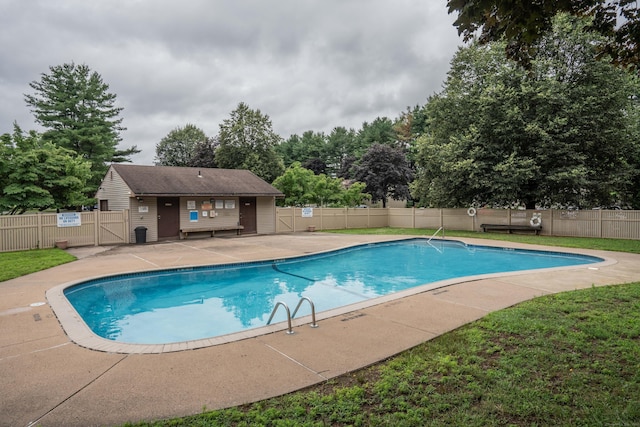 506 Twin Circle Dr Unit 506, South Windsor, CT 06074 - community pool featuring a gate, a fenced backyard, a patio area, and view of wooded area