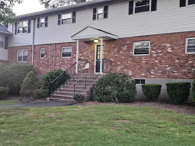 508 Oak Ave Apt 7, Cheshire, CT 06410 - view of front facade featuring a front lawn and brick siding