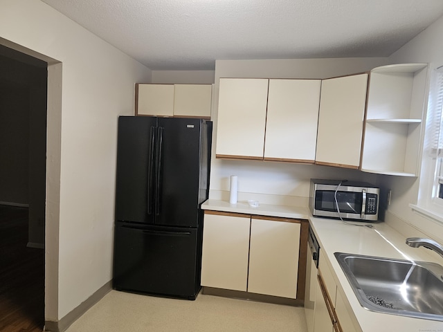 508 Oak Ave Apt 7, Cheshire, CT 06410 - kitchen featuring freestanding refrigerator, stainless steel microwave, open shelves, light countertops, and dishwasher