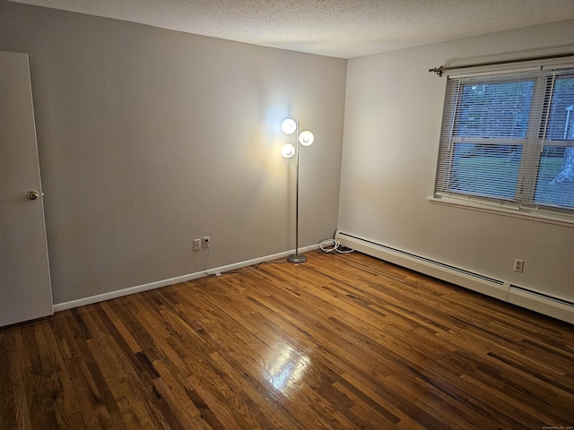 508 Oak Ave Apt 7, Cheshire, CT 06410 - empty room with wood finished floors, a textured ceiling, and a baseboard radiator