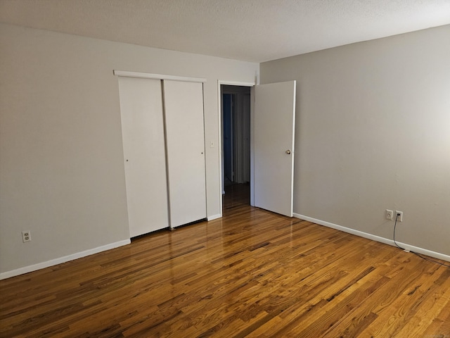 508 Oak Ave Apt 7, Cheshire, CT 06410 - unfurnished bedroom with wood finished floors and a closet