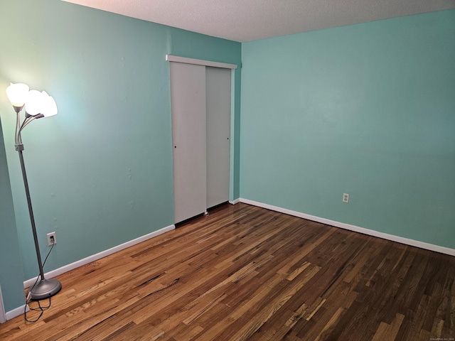 508 Oak Ave Apt 7, Cheshire, CT 06410 - unfurnished bedroom with wood finished floors and a closet
