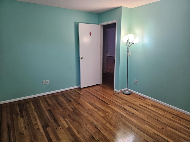 508 Oak Ave Apt 7, Cheshire, CT 06410 - unfurnished bedroom with wood finished floors and baseboard heating