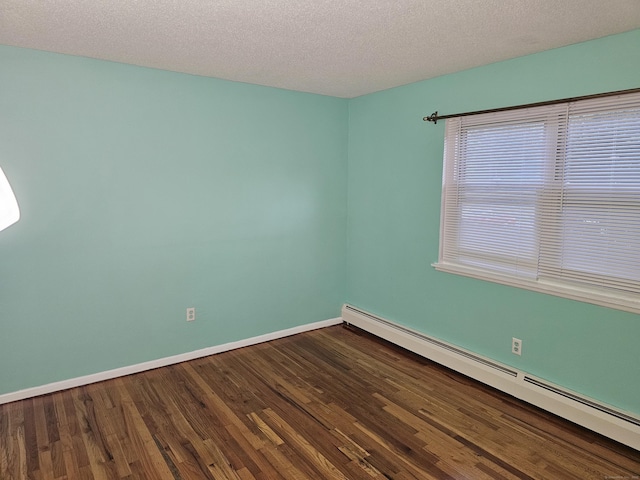 508 Oak Ave Apt 7, Cheshire, CT 06410 - unfurnished room featuring baseboard heating, wood finished floors, and a textured ceiling