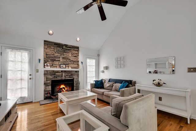 114 Tiffany Ln, Bristol, CT 06010 - living room with a ceiling fan, a fireplace, high vaulted ceiling, and light wood-style floors