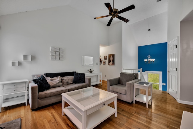 114 Tiffany Ln, Bristol, CT 06010 - living room featuring high vaulted ceiling, a chandelier, a ceiling fan, and light wood-style floors