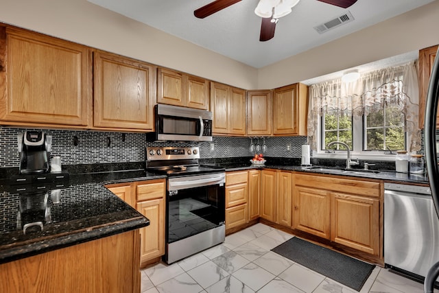 114 Tiffany Ln, Bristol, CT 06010 - kitchen with appliances with stainless steel finishes, ceiling fan, light marble finish floors, and tasteful backsplash
