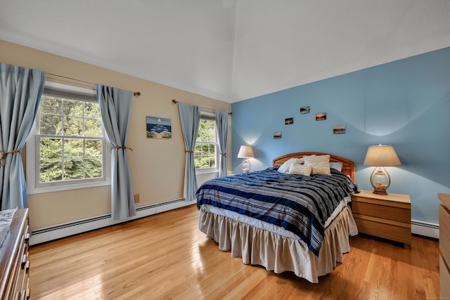 114 Tiffany Ln, Bristol, CT 06010 - bedroom with light wood-style flooring, vaulted ceiling, and a baseboard heating unit