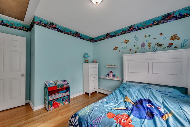 114 Tiffany Ln, Bristol, CT 06010 - bedroom with wood finished floors and a baseboard heating unit