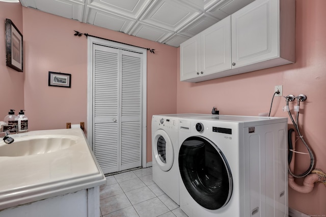 114 Tiffany Ln, Bristol, CT 06010 - washroom featuring cabinet space, separate washer and dryer, and light tile patterned floors