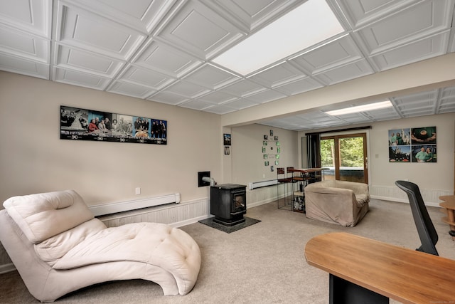 114 Tiffany Ln, Bristol, CT 06010 - living area with a baseboard radiator, a wood stove, carpet floors, and an ornate ceiling