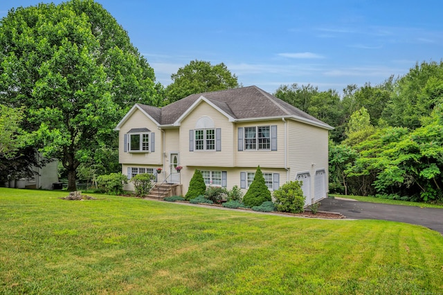 114 Tiffany Ln, Bristol, CT 06010 - bi-level home featuring a garage, asphalt driveway, and a front lawn