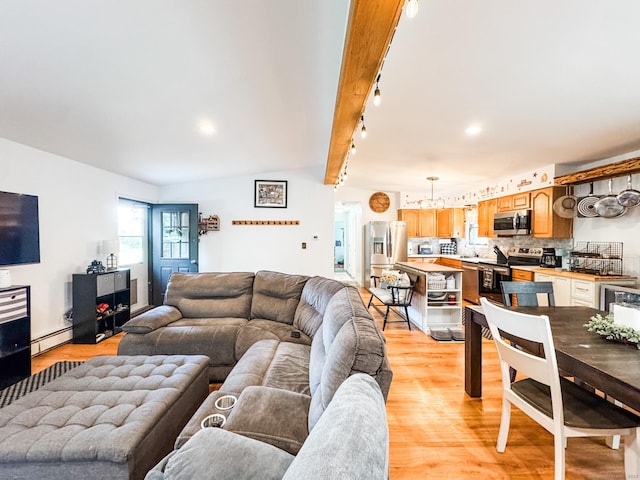 64 Spaulding Rd, Plainfield, CT 06374 - living room with a baseboard heating unit, light wood-style floors, and recessed lighting