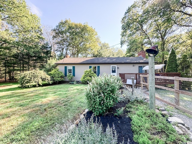 64 Spaulding Rd, Plainfield, CT 06374 - rear view of property with a chimney, a yard, and a deck