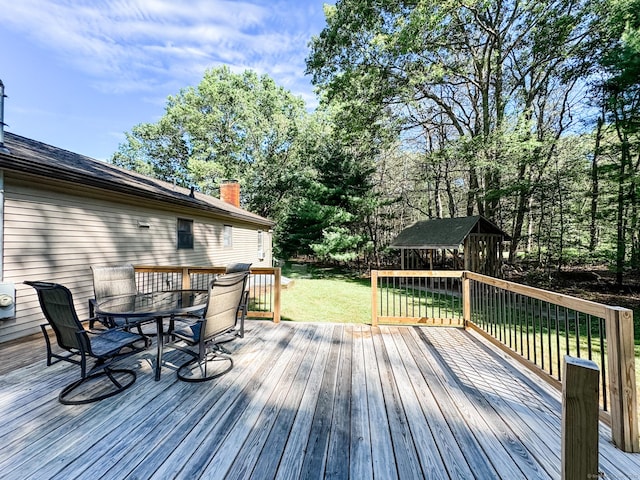 64 Spaulding Rd, Plainfield, CT 06374 - wooden terrace with a lawn, outdoor dining space, and an outbuilding