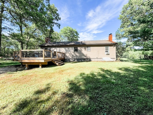 64 Spaulding Rd, Plainfield, CT 06374 - back of house featuring a chimney, a yard, and a wooden deck