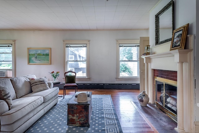 240 Main St, Salisbury, CT 06068 - living area featuring plenty of natural light, wood-type flooring, a tile fireplace, ornamental molding, and cooling unit