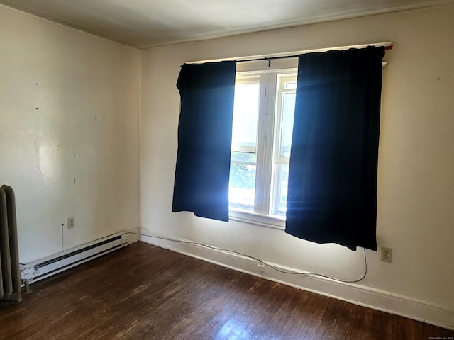 173 Fairview Ave, Bridgeport, CT 06606 - spare room featuring a baseboard radiator, healthy amount of natural light, and wood finished floors