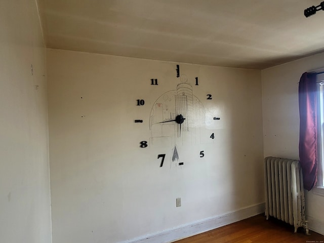 173 Fairview Ave, Bridgeport, CT 06606 - spare room featuring radiator heating unit, wood finished floors, and healthy amount of natural light