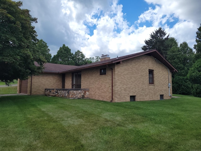 62 Rice Rd, Meriden, CT 06450 - view of side of property featuring a chimney, brick siding, and a yard
