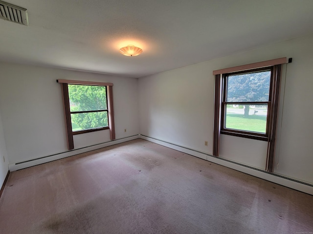 62 Rice Rd, Meriden, CT 06450 - unfurnished room featuring healthy amount of natural light, carpet flooring, and a baseboard heating unit